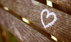 brown wooden panel with white heart